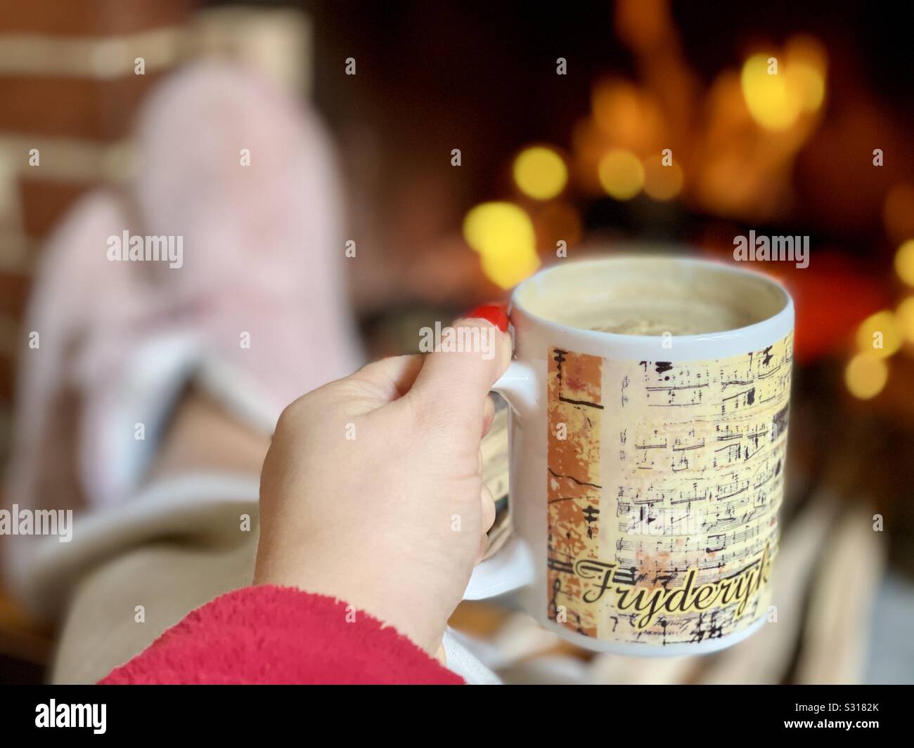 Drinking coffee in front of the fireplace - Smartphone Captured Stock Image