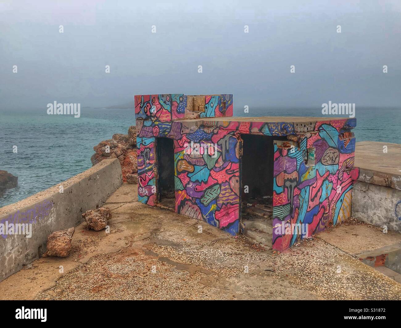 Colorful abandoned derelict building on a cloudy winters day - Smartphone Captured Stock Image