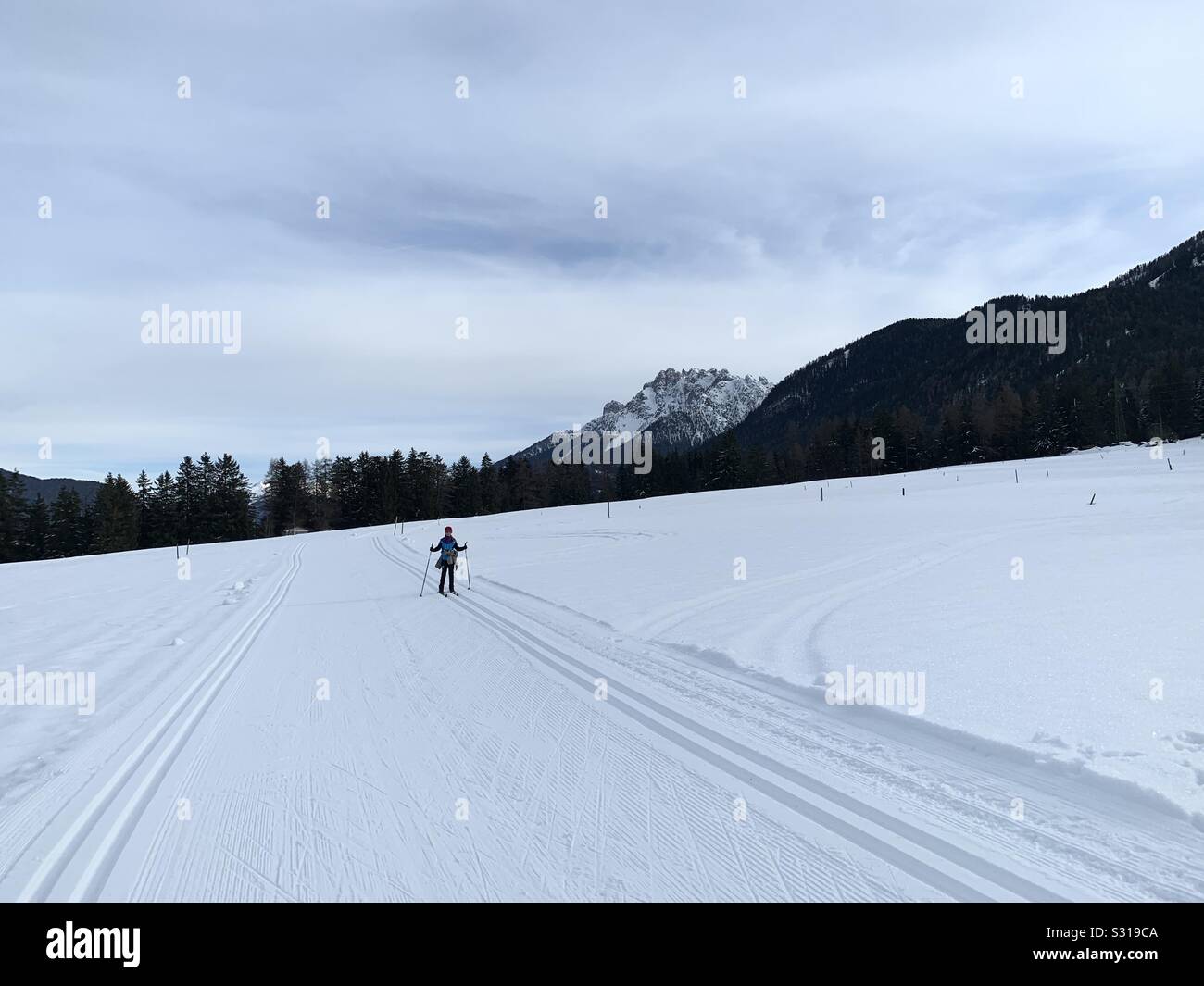 Cross country skier in a snowy mountain landscape. Italy. - Smartphone Captured Stock Image