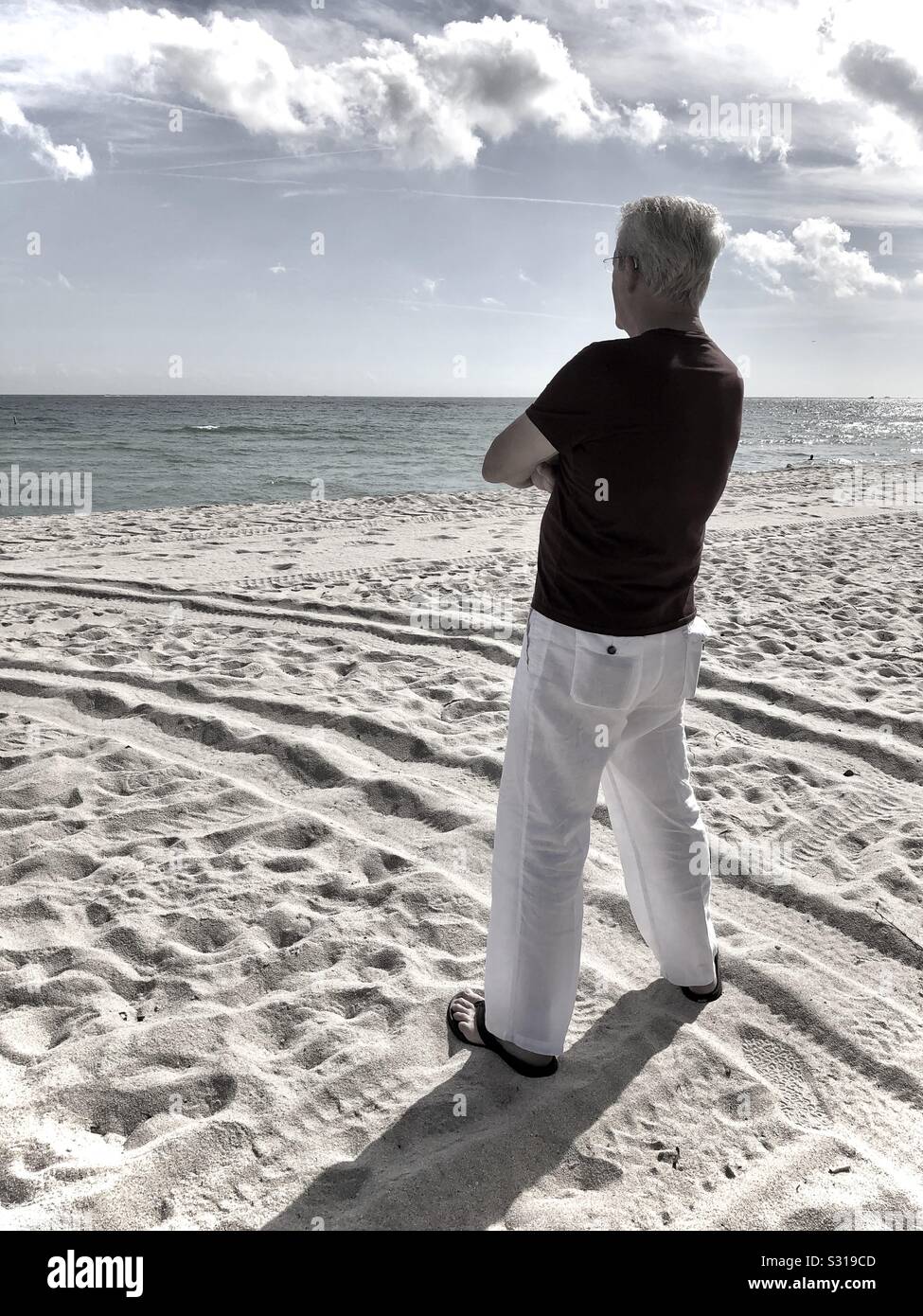 Lone man looking out at the ocean, Fort Lauderdale, Florida. - Smartphone Captured Stock Image