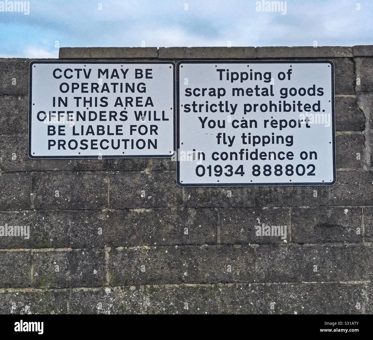 Signs warning against fly tipping in Weston-super-Mare, UK - Smartphone Captured Stock Image