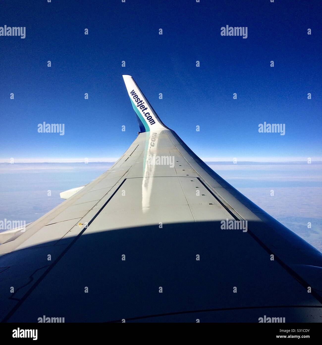 Boeing 737 winglet with Westjet airline company logo. Stock Photo