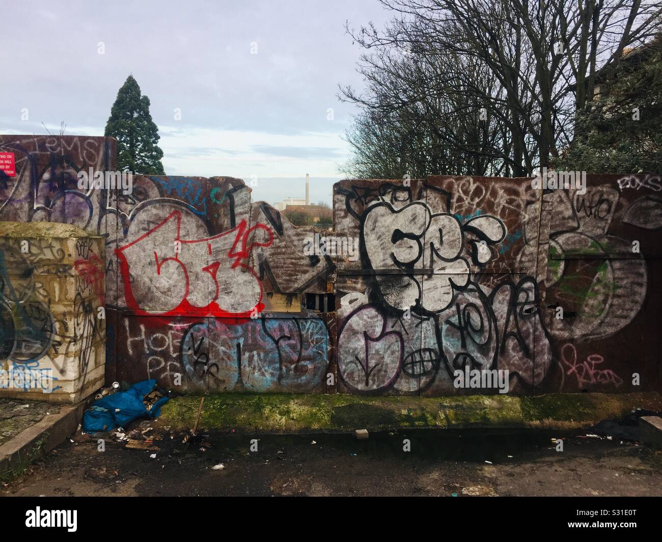 A graffiti covered wooden fence in New Cross, SE London. Stock Photo