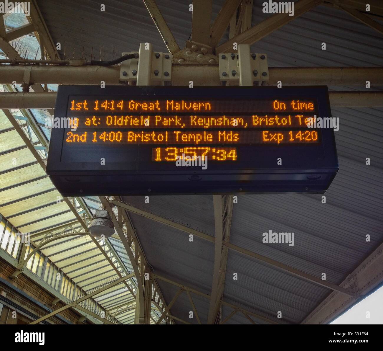 A destination board at Bath Spa railway station in Bath, UK showing details of trains to Great Malvern, Oldfield Park, Keynsham and Bristol Temple Meads - Smartphone Captured Stock Image