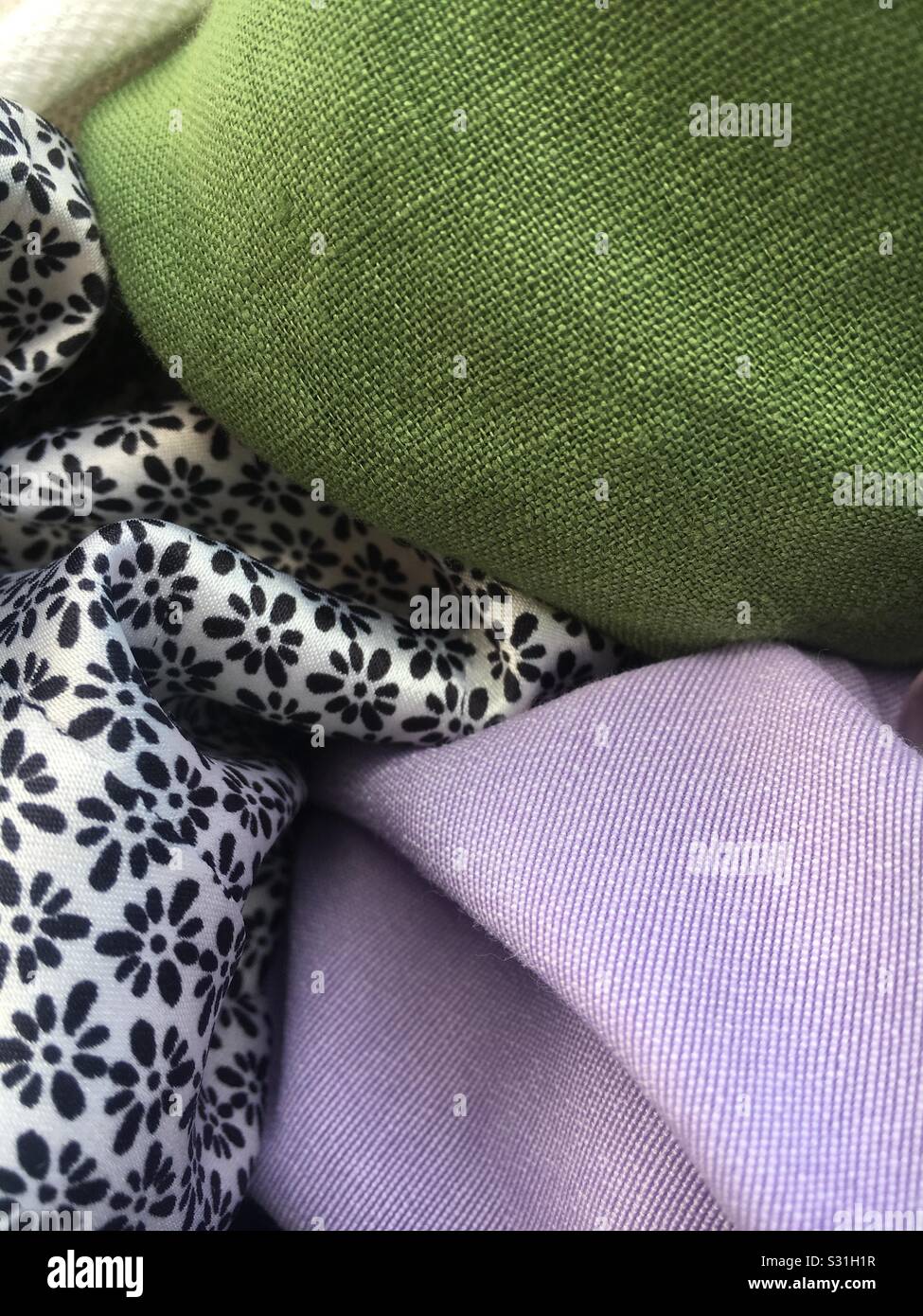 Fabrics from thrift shop Stock Photo Alamy