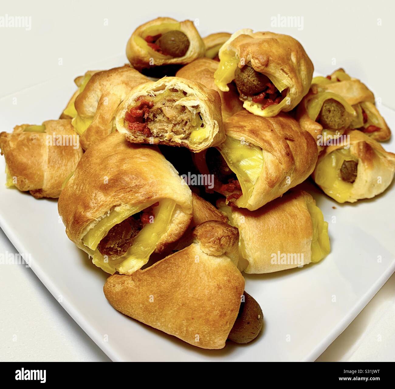 Cheesy Bacon Pigs in a Blanket Stock Photo Alamy