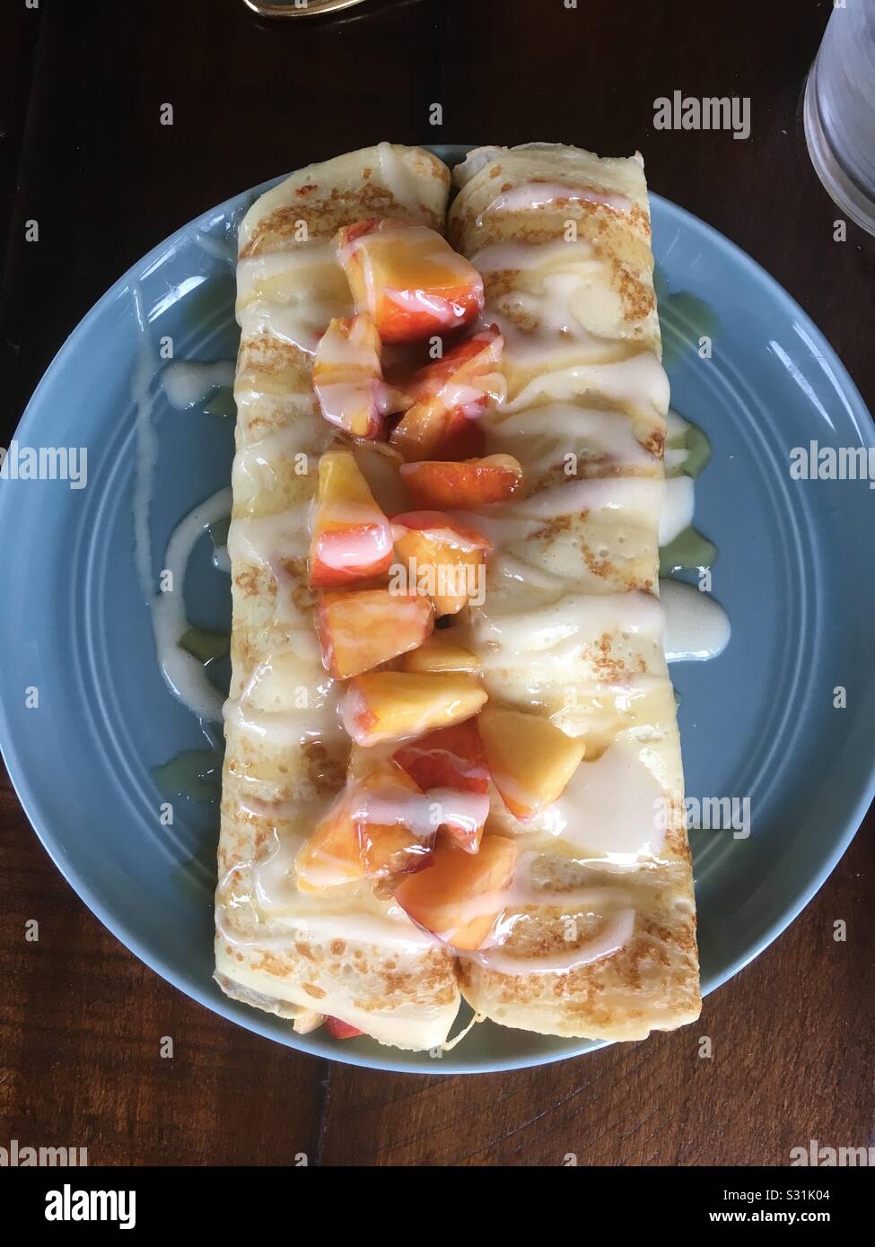 Peach crepe with cream cheese filling Stock Photo Alamy
