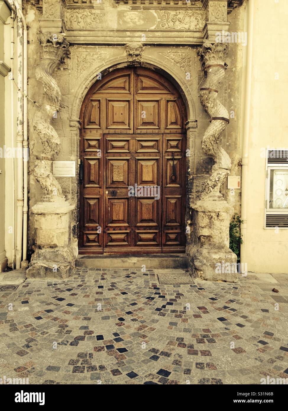 Ornate and decorative doorway in Arles, France. - Smartphone Captured Stock Image