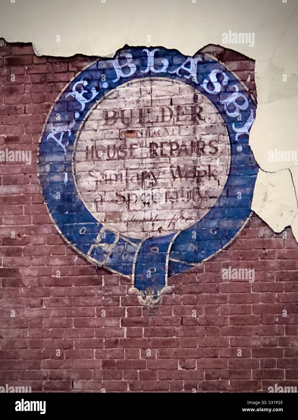 Old advertising sign revealed beneath external render - Smartphone Captured Stock Image Old advertising sign revealed beneath external render - Smartphone Captured Stock Image