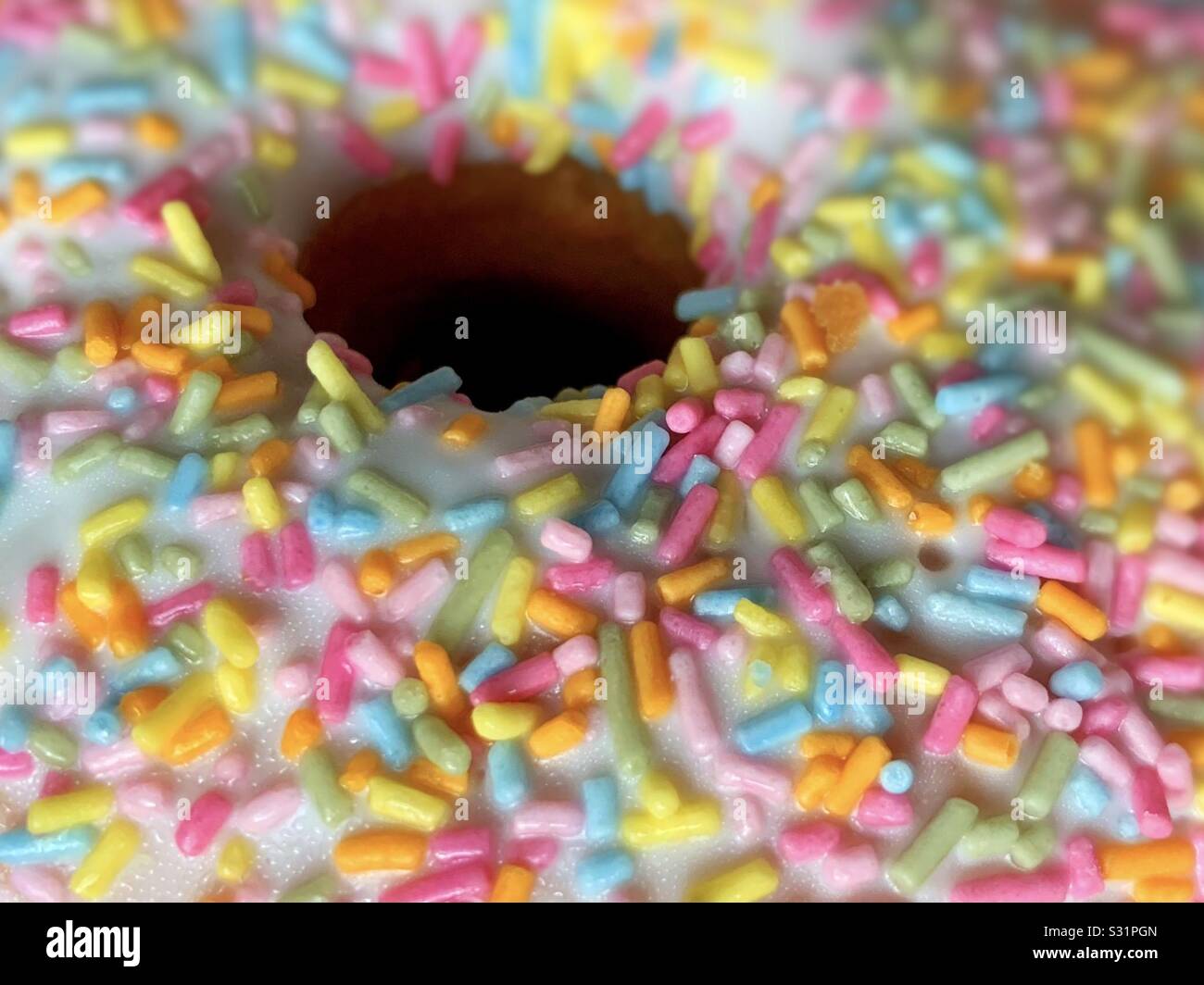 Close up of a hole in a donut.  Doughnut centre Stock Photo