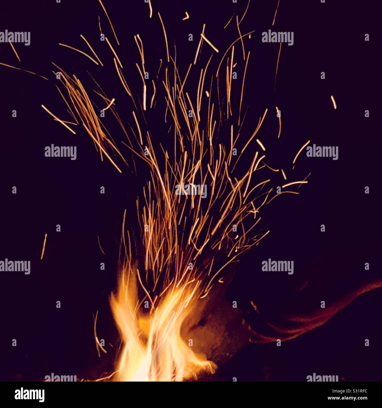 Sparkling fire at night. Stock Photo