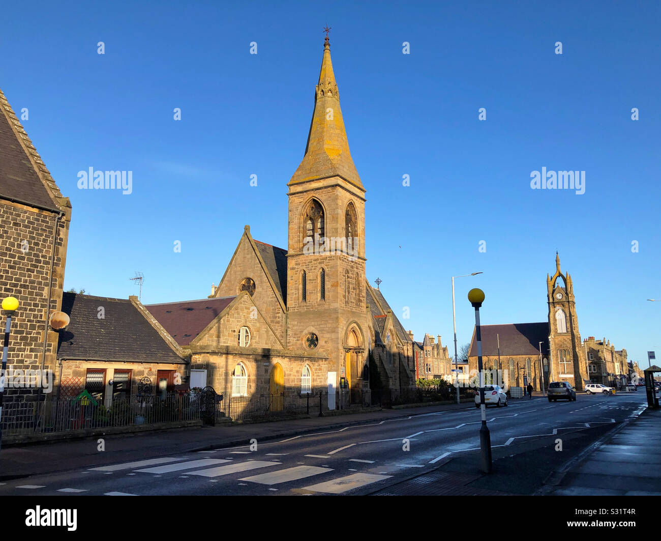 West Church Street, Buckie, Banffshire, (Moray), Scotland with Buckie Episcopal Church in the foreground, and the North Church in East Church Street Stock Photo