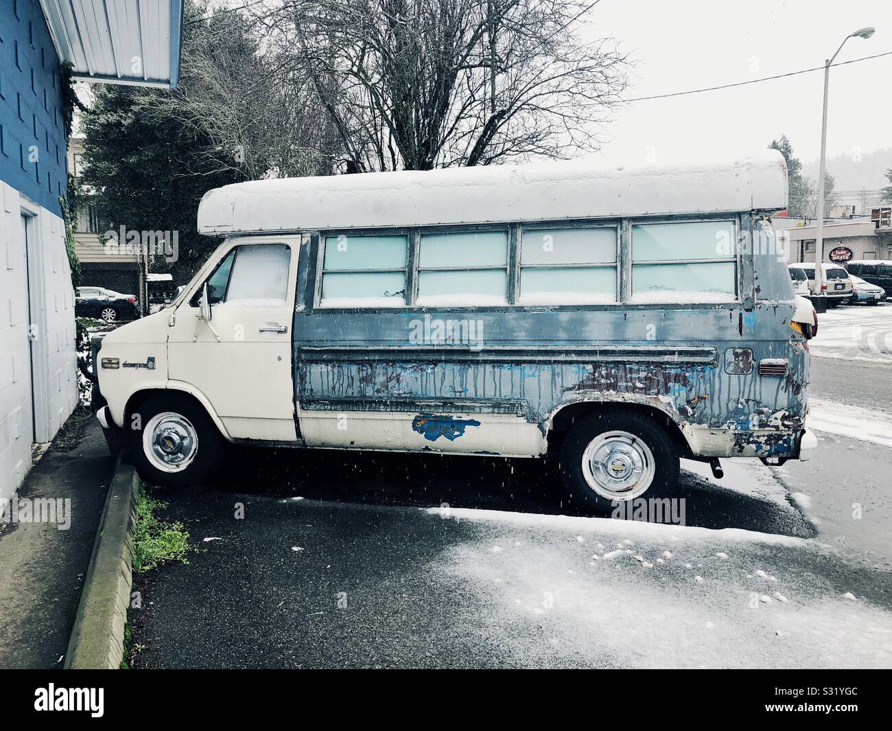 Old vintage van on snowy winter street - Smartphone Captured Stock Image