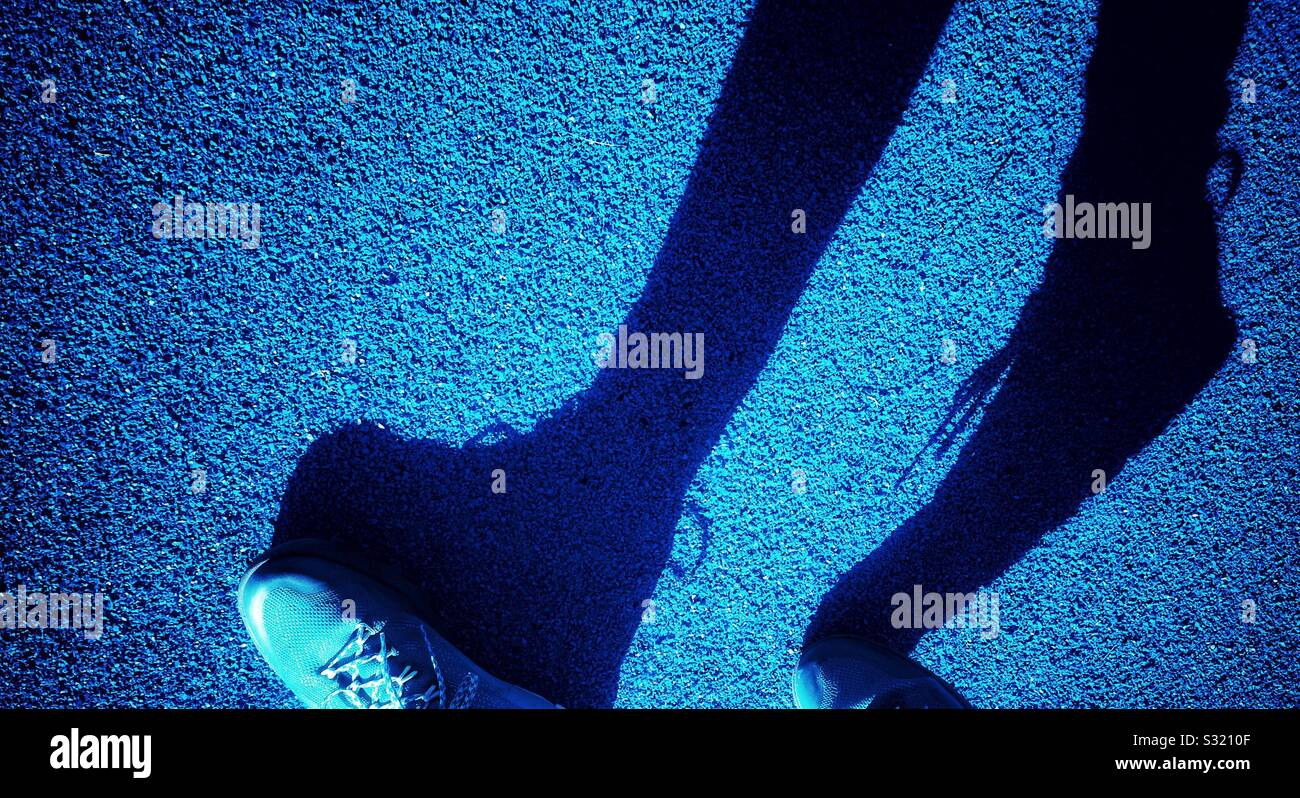 Shadow of feet walking - Smartphone Captured Stock Image