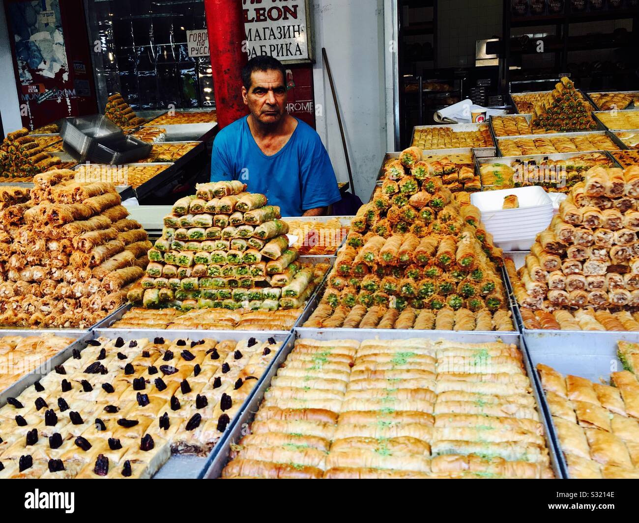 A Middle eastern pastry sweets vendor in the market in Jerusalem. - Smartphone Captured Stock Image