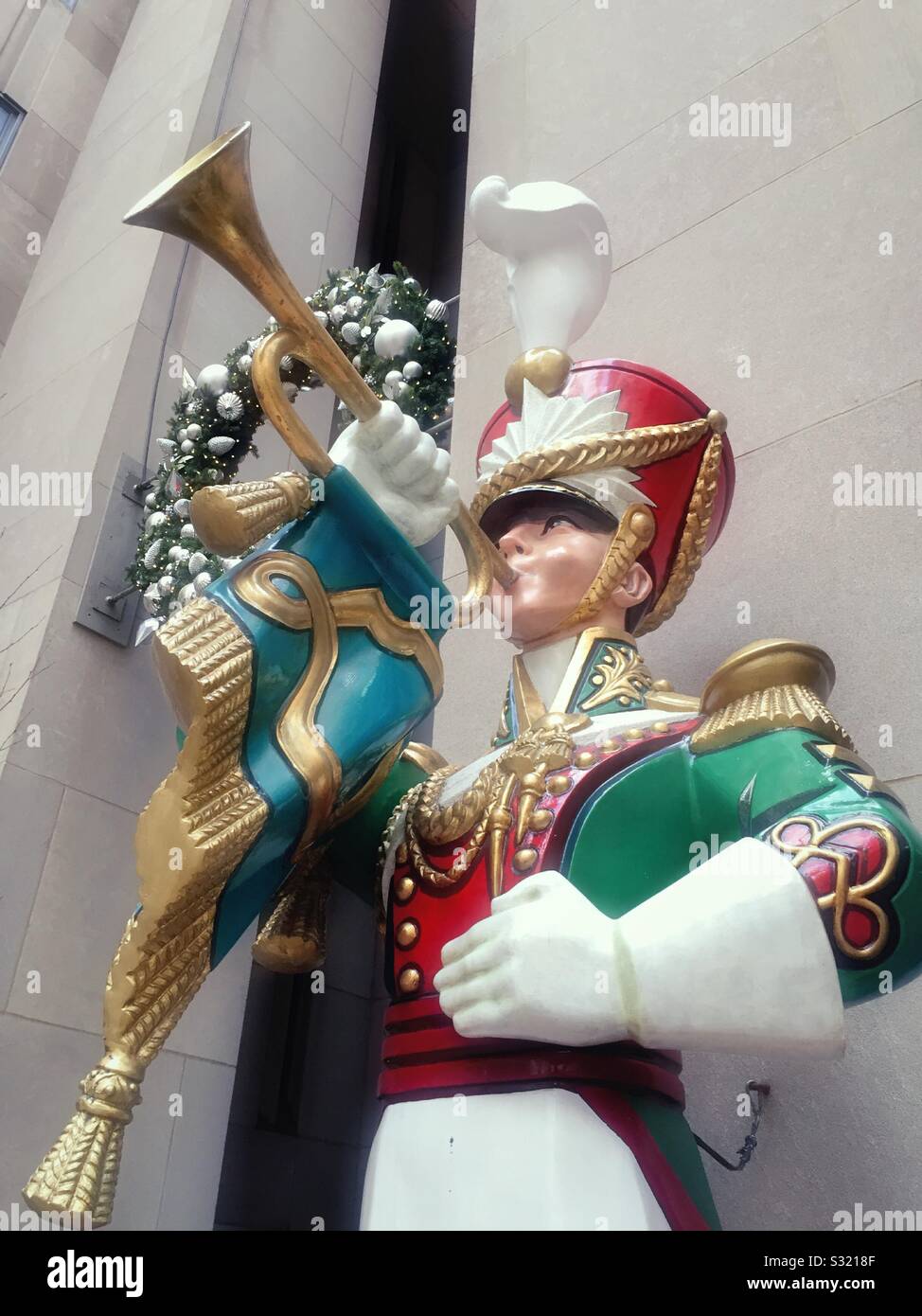 Giant toy soldier statue decoration in Rockefeller Center during the Christmas season, NYC, USA - Smartphone Captured Stock Image