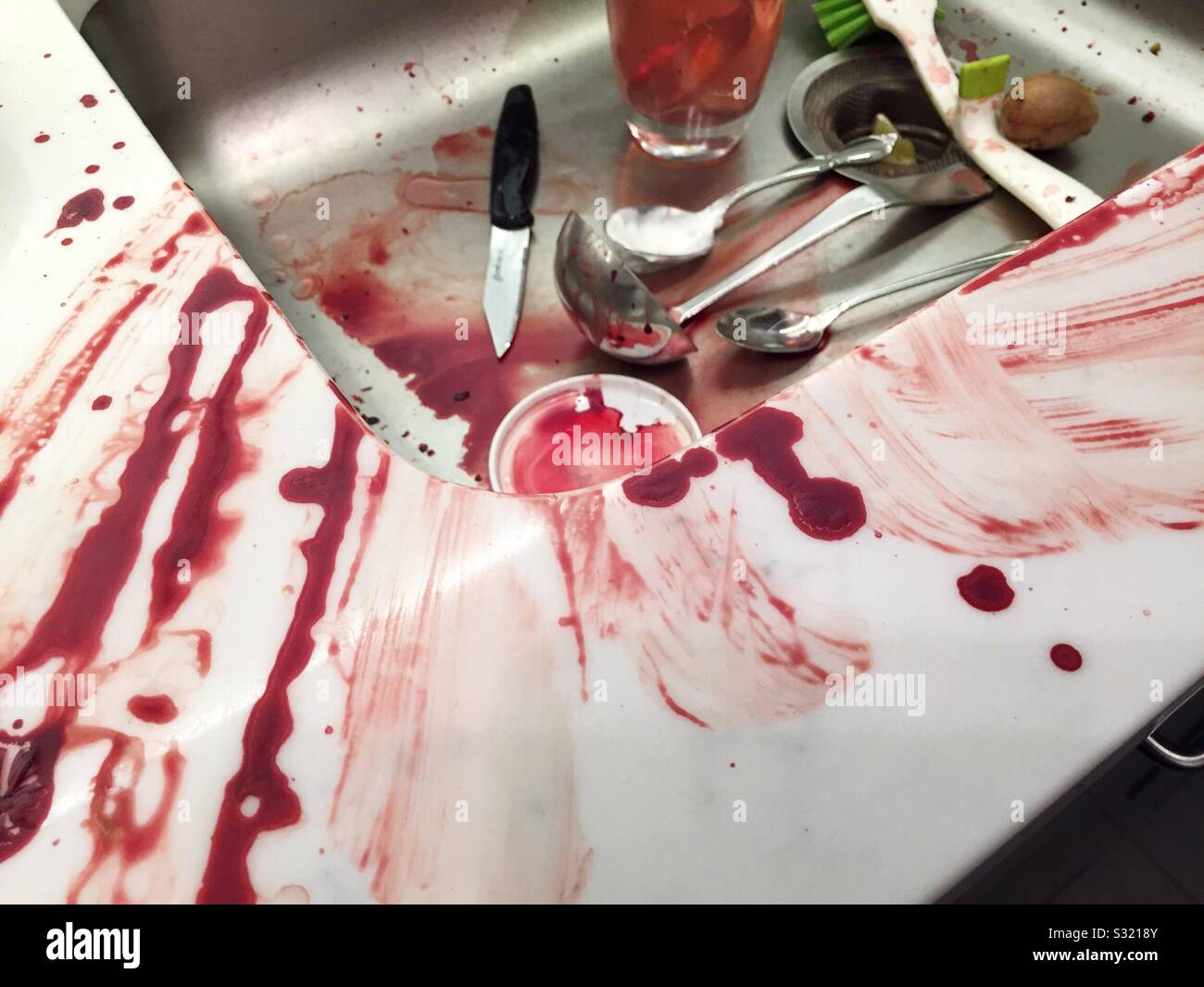 Residential kitchen is a bloody mess after a knife accident - Smartphone Captured Stock Image