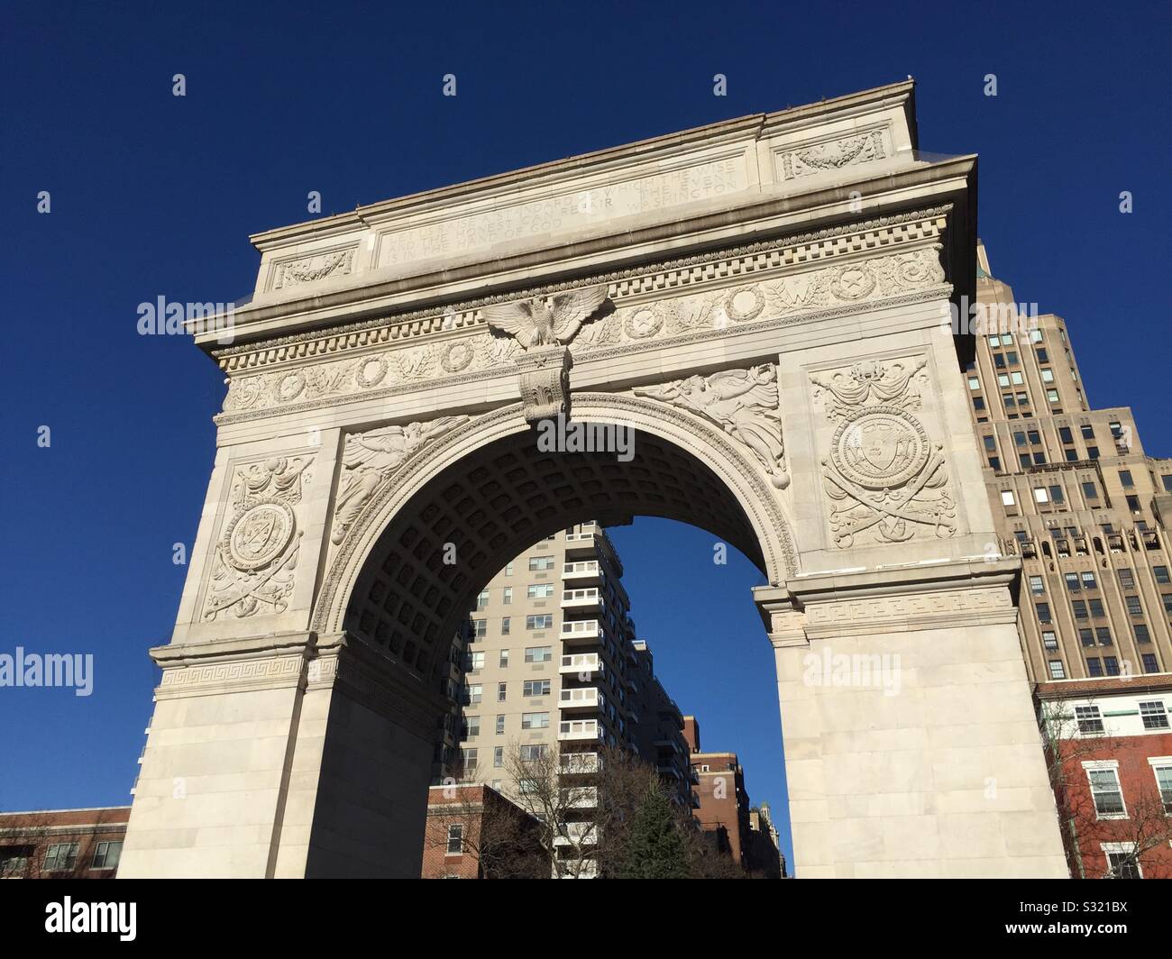 Washington Square arch is located in Washington Square, Park in Greenwich village at the terminus of fifth Ave., NYC, USA Stock Photo