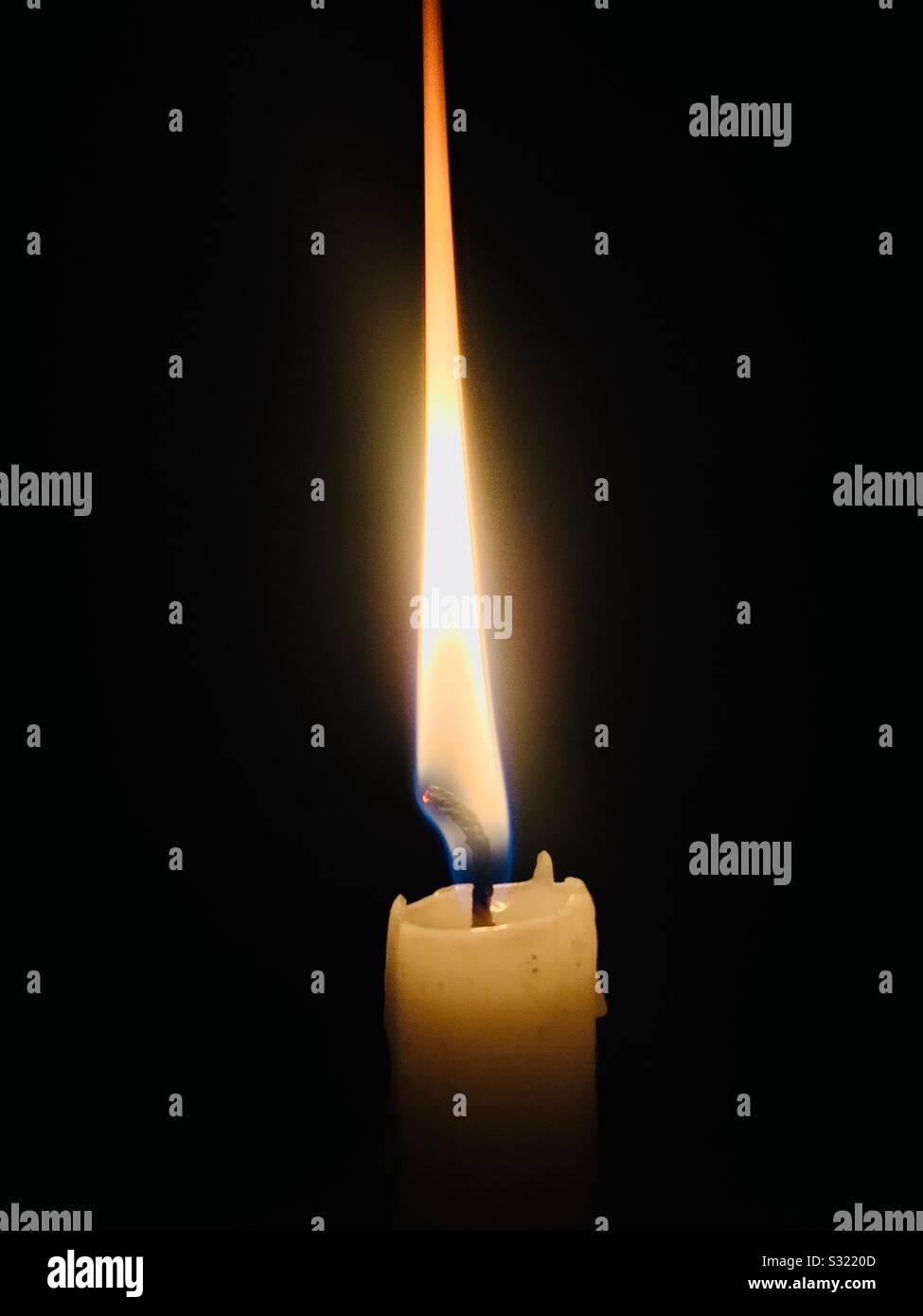 Look at how a single candle can defy and define the darkness. ? Stock Photo