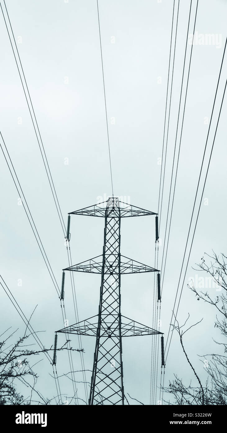 Pylon and power lines in winter Stock Photo - Alamy