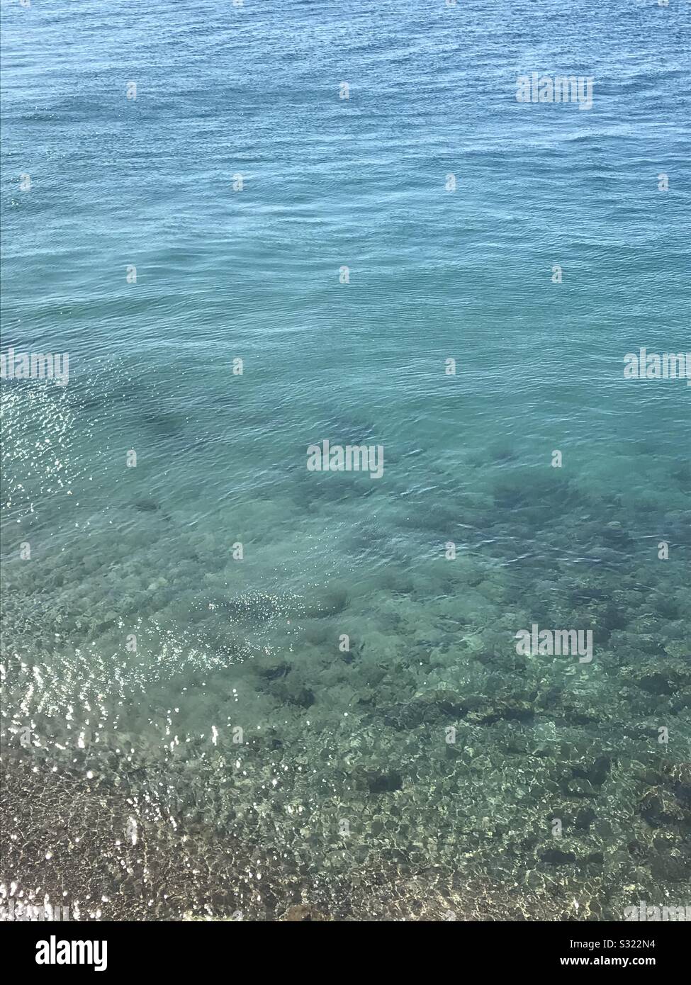 Clear blue green sea water Patras Greece - Smartphone Captured Stock Image