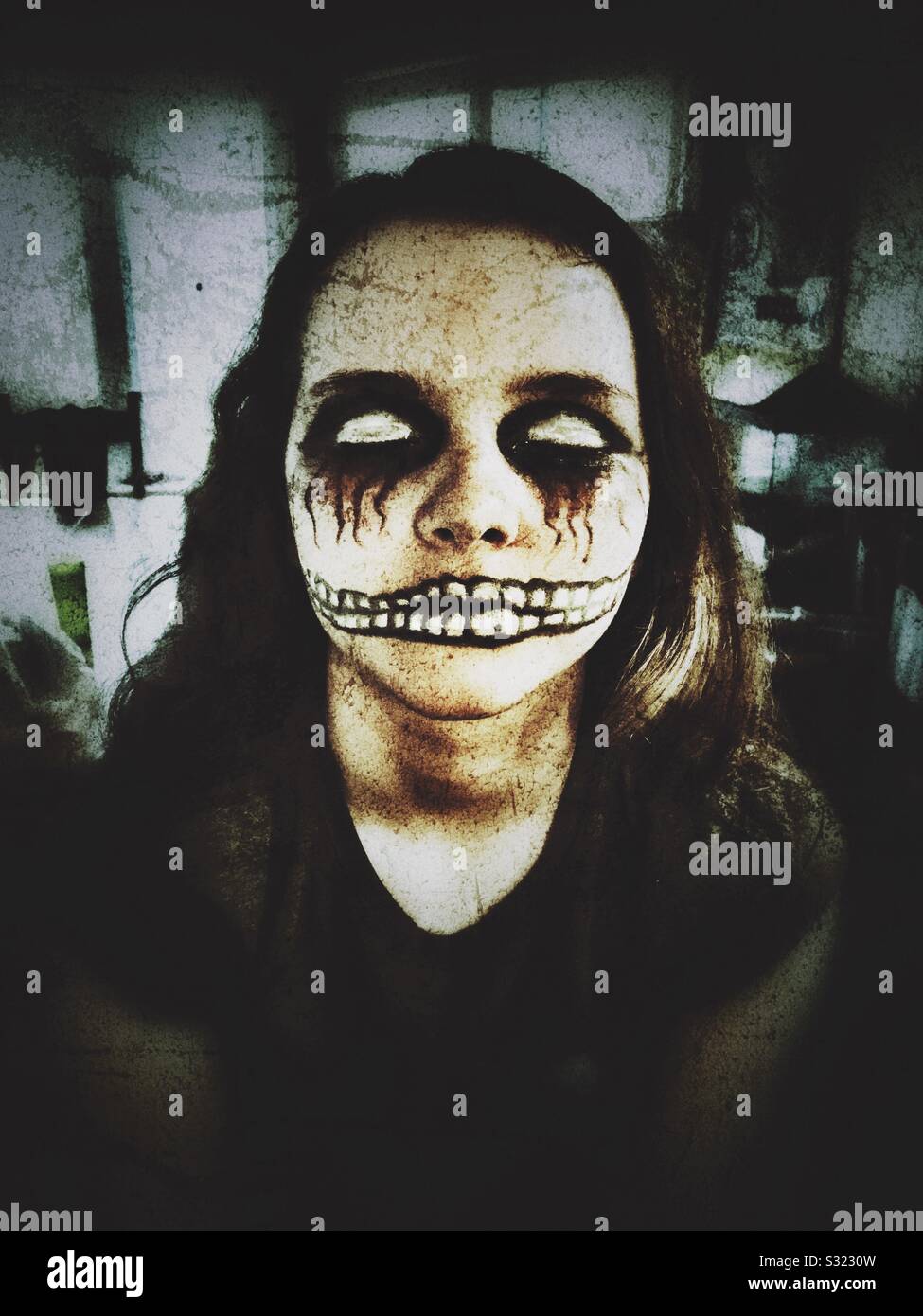 12 year old girl in creepy Halloween makeup Stock Photo