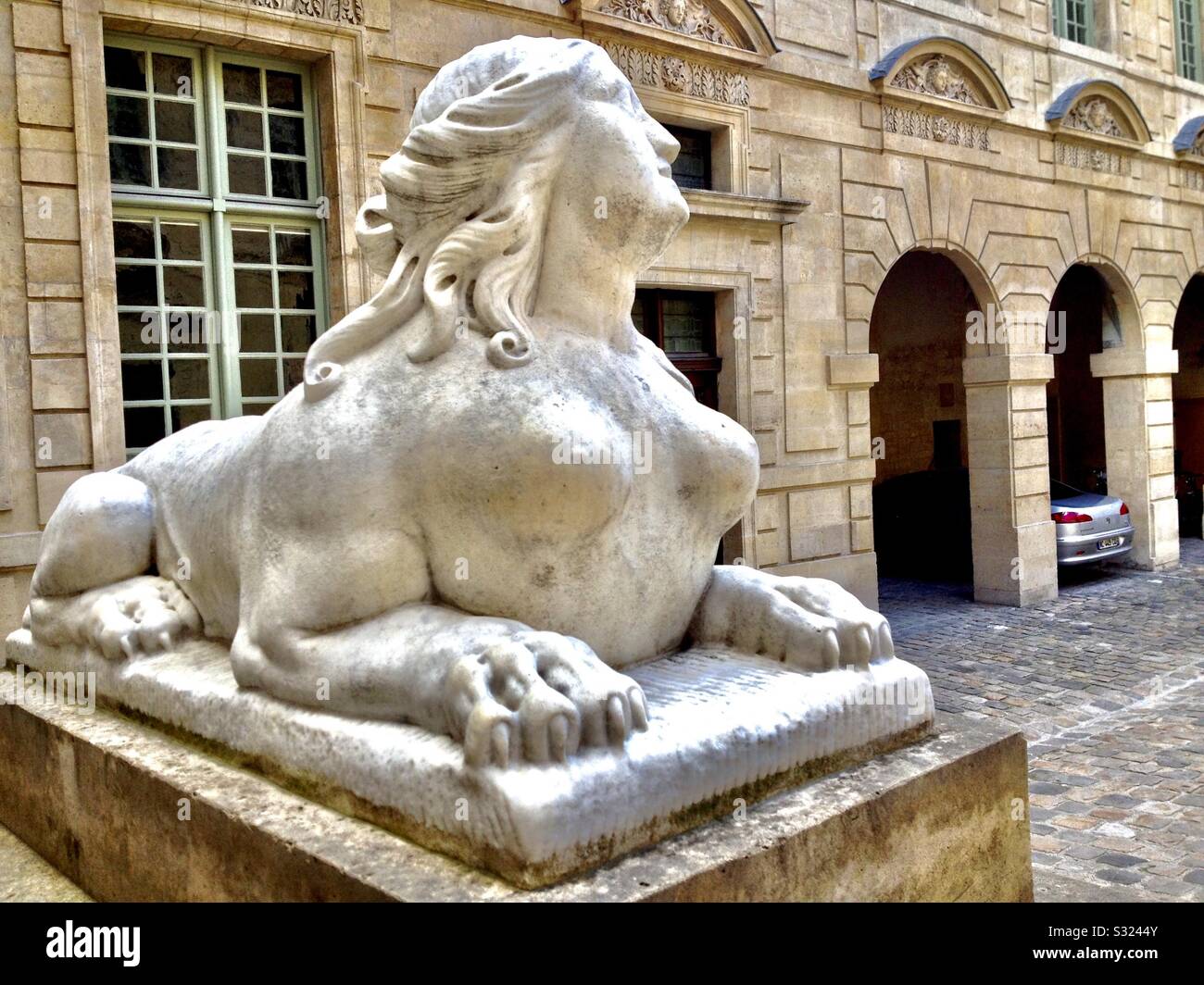 Sphinx sculpture in Le Marais, Paris, France, by Hotel de Sully. - Smartphone Captured Stock Image