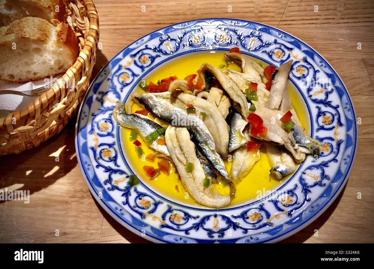 Pickled anchovies in olive oil with red and green peppers, pintxo in San Sebastián, Basque Country, Spain - Smartphone Captured Stock Image