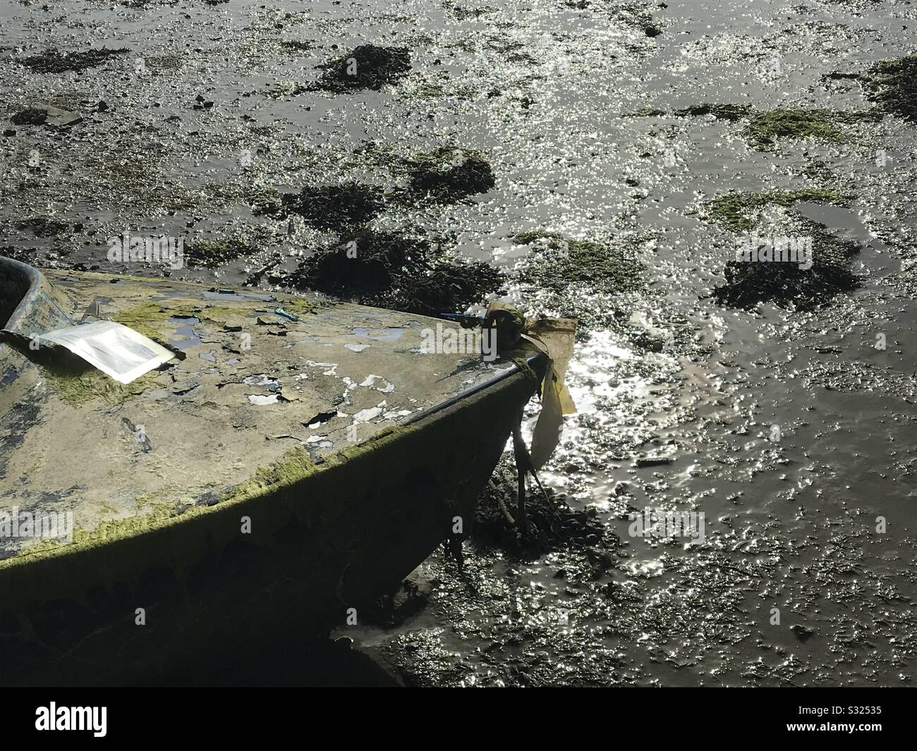 Close up of canoe on mudflats - Smartphone Captured Stock Image