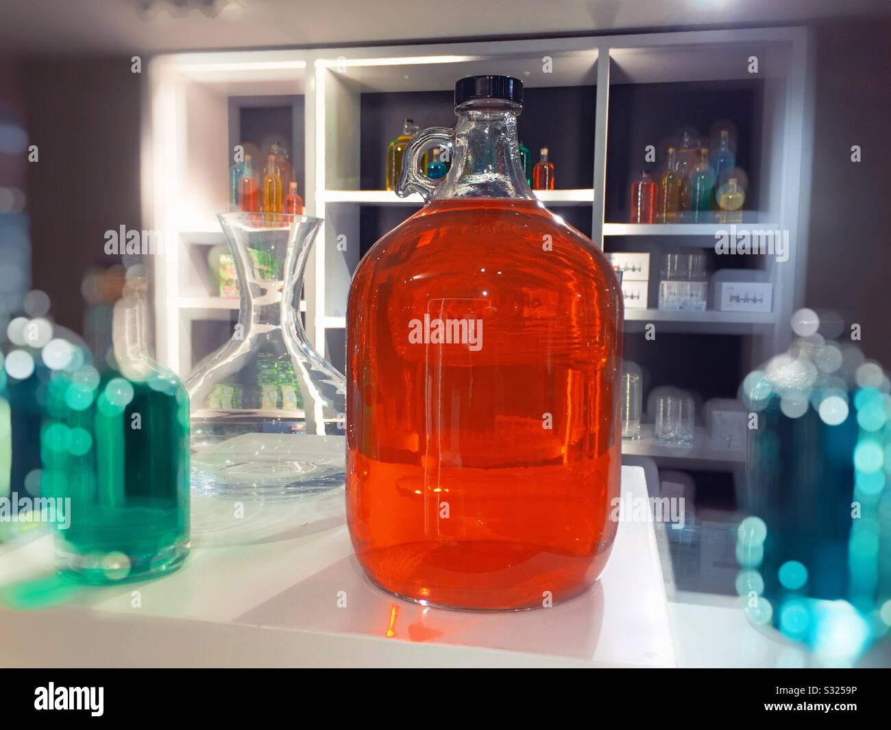 Large jug handled bottle as part of the sales display in a department store in the United States - Smartphone Captured Stock Image