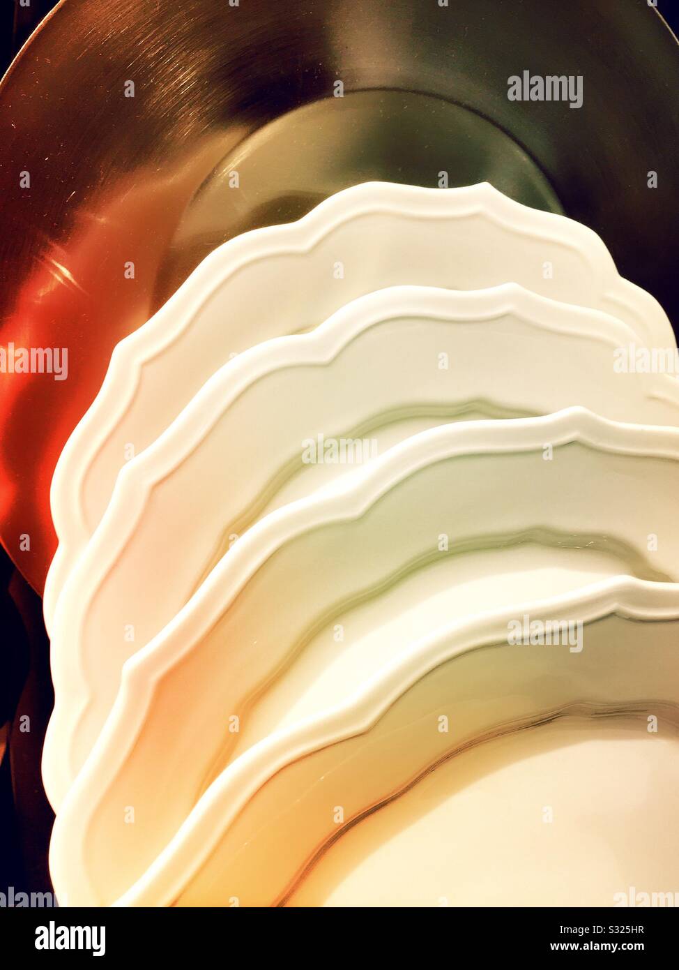 Scalloped ceramic plates on sale at a department store in the United States - Smartphone Captured Stock Image