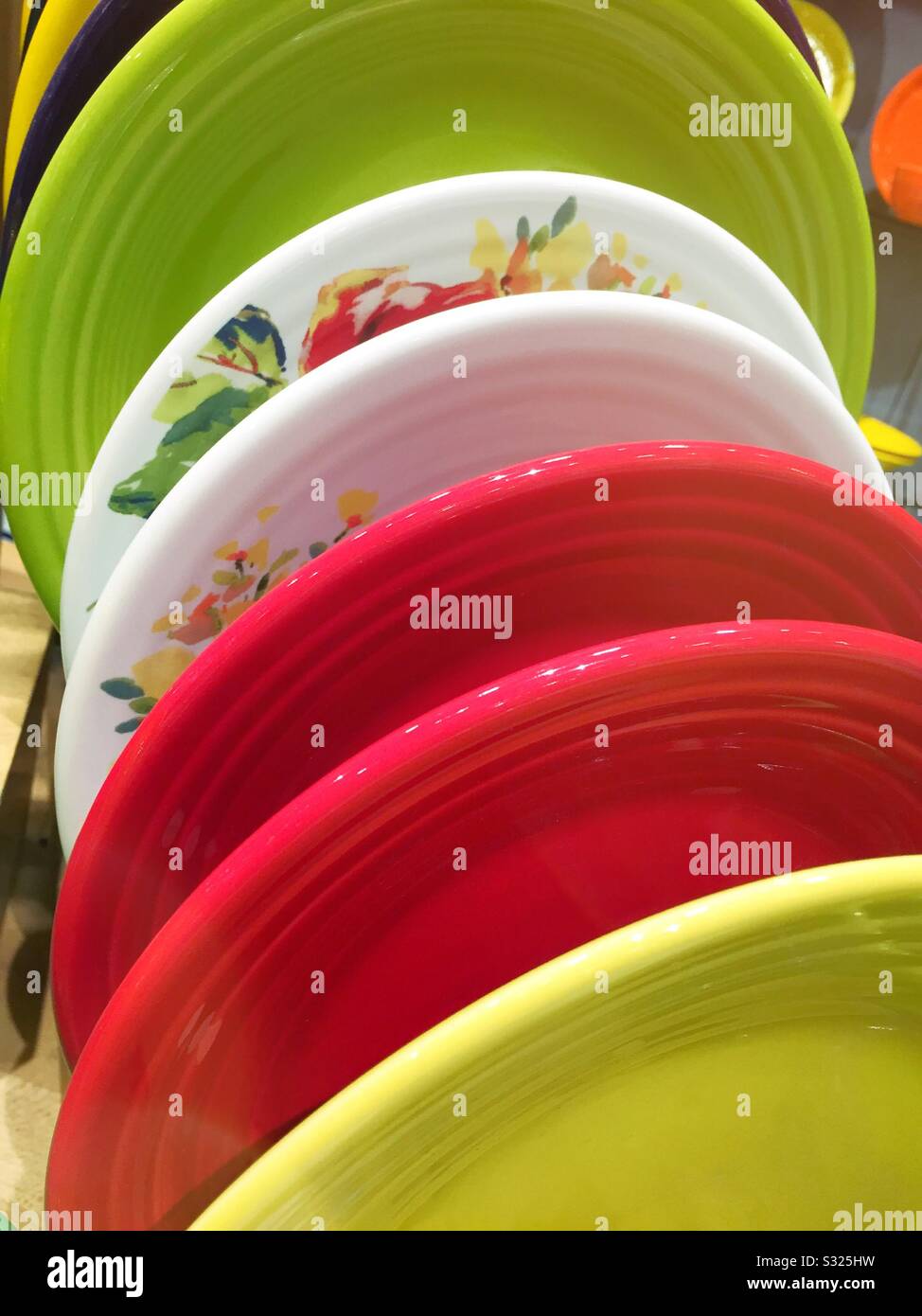 Fiesta dishware plates on display for sale at a retail store in the United States - Smartphone Captured Stock Image