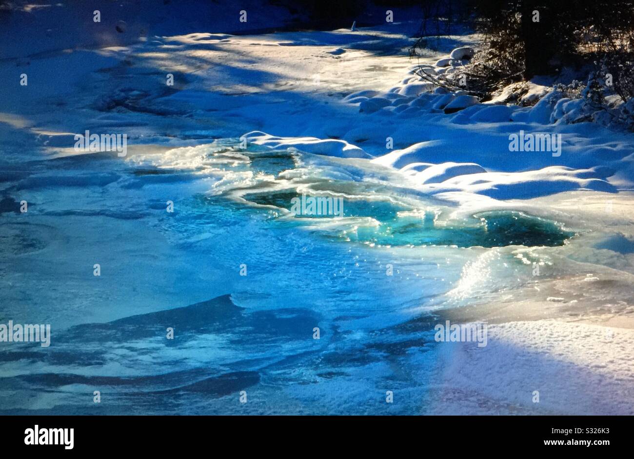 Travel Alberta, Baker Creek, winter sun, Banff National Park, Alberta, Canada. - Smartphone Captured Stock Image