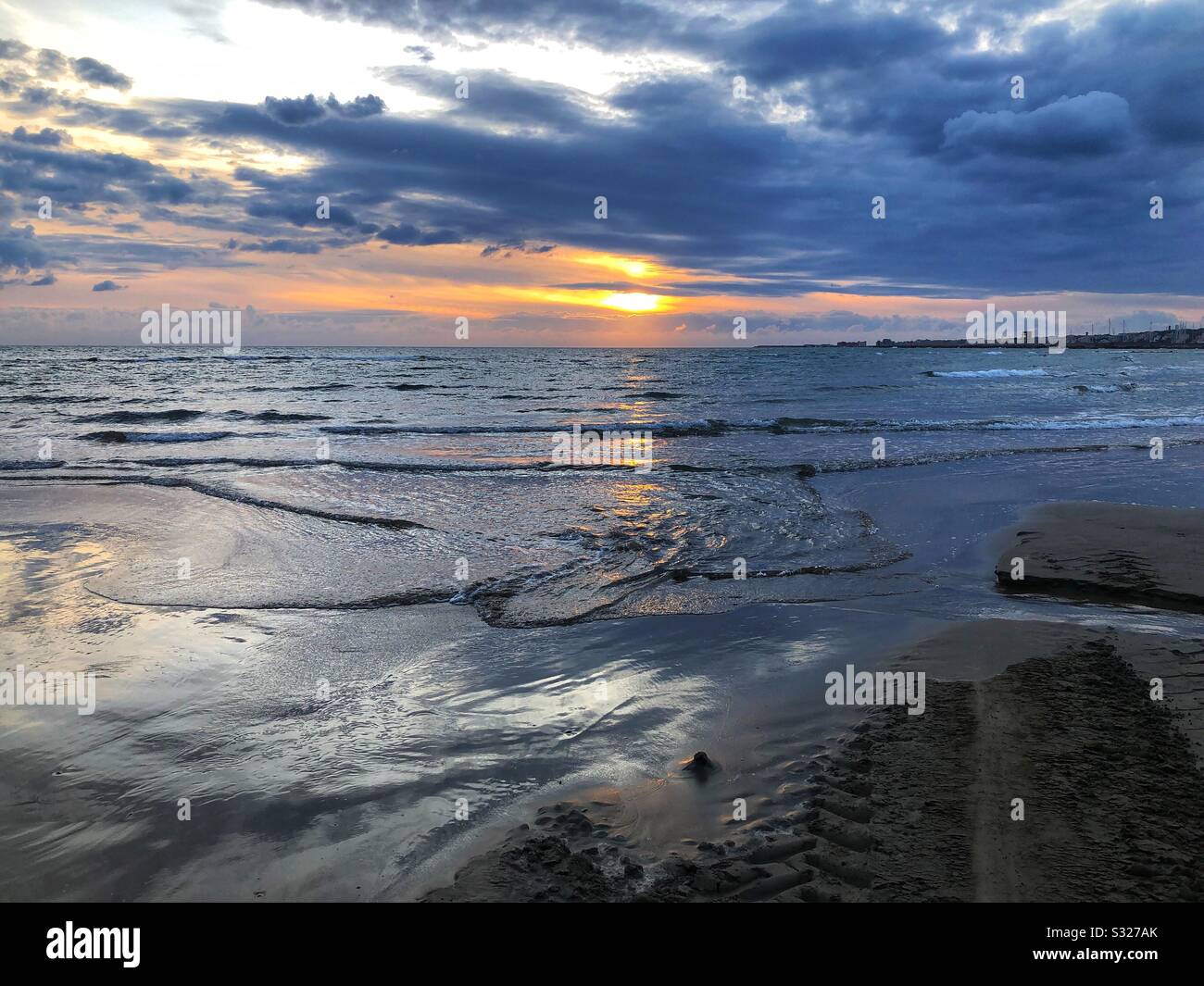 Sunset at the beach in Italy Stock Photo