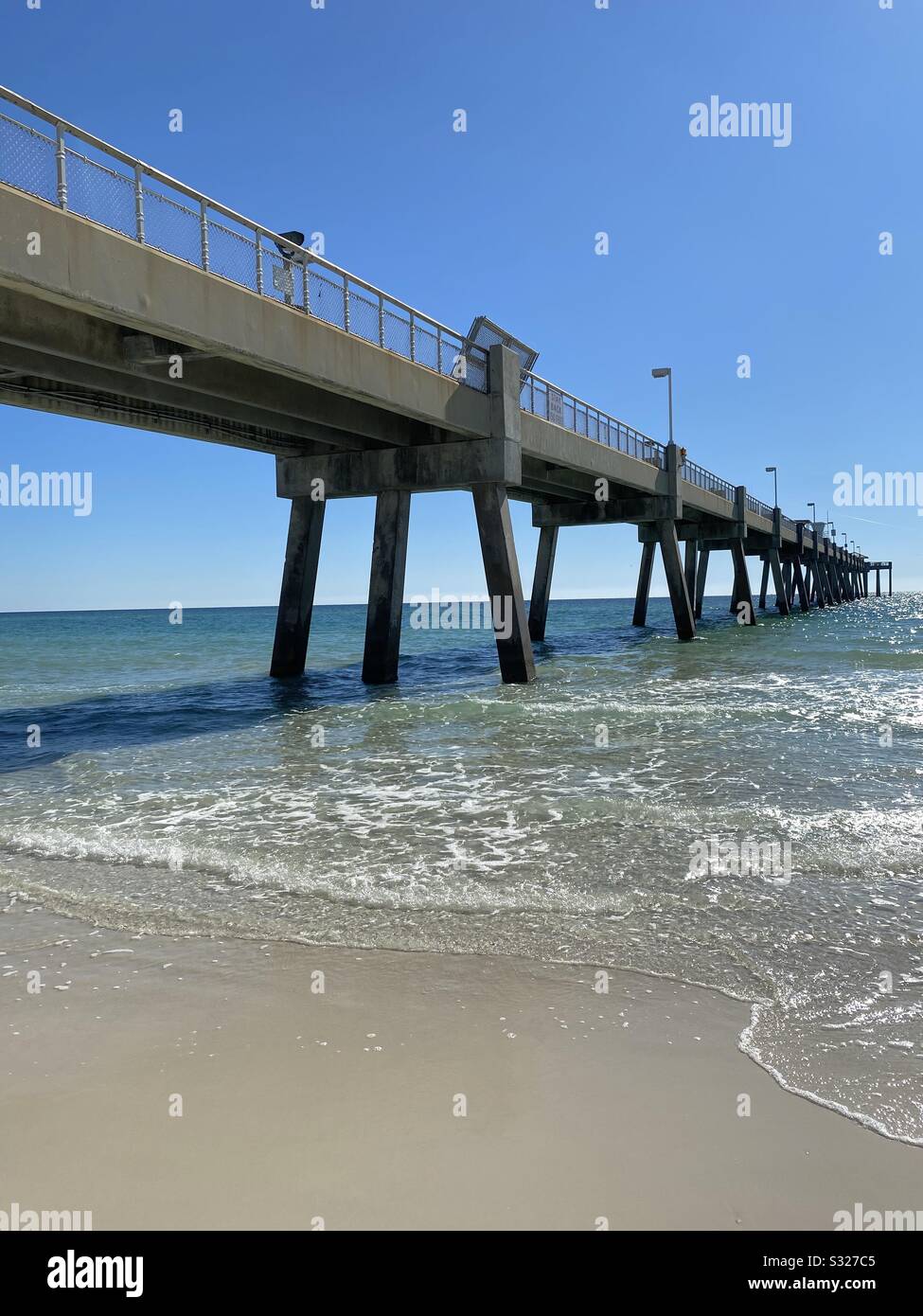 Side view of public fishing pier Okaloosa Island in Florida Stock Photo