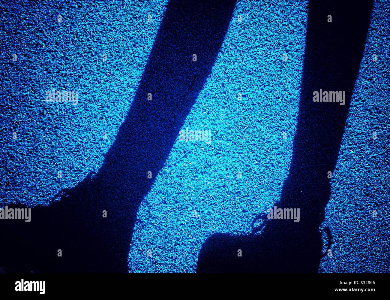 Pedestrian shadow walking on street - Smartphone Captured Stock Image