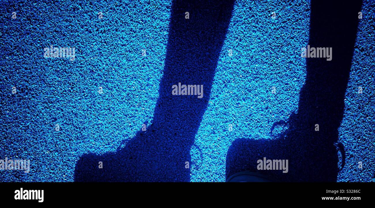 Pedestrian feet shadow - Smartphone Captured Stock Image