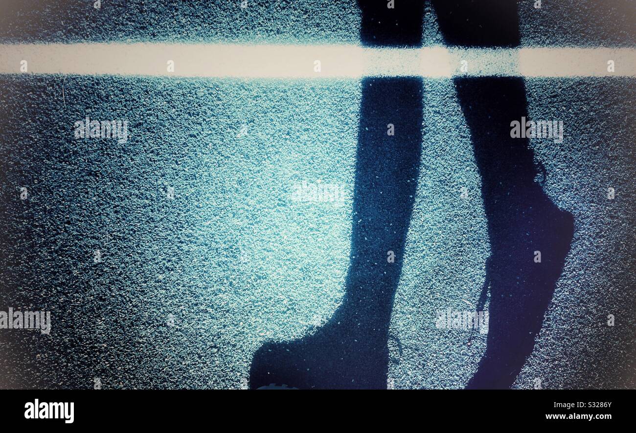 Pedestrian shadow walking - Smartphone Captured Stock Image