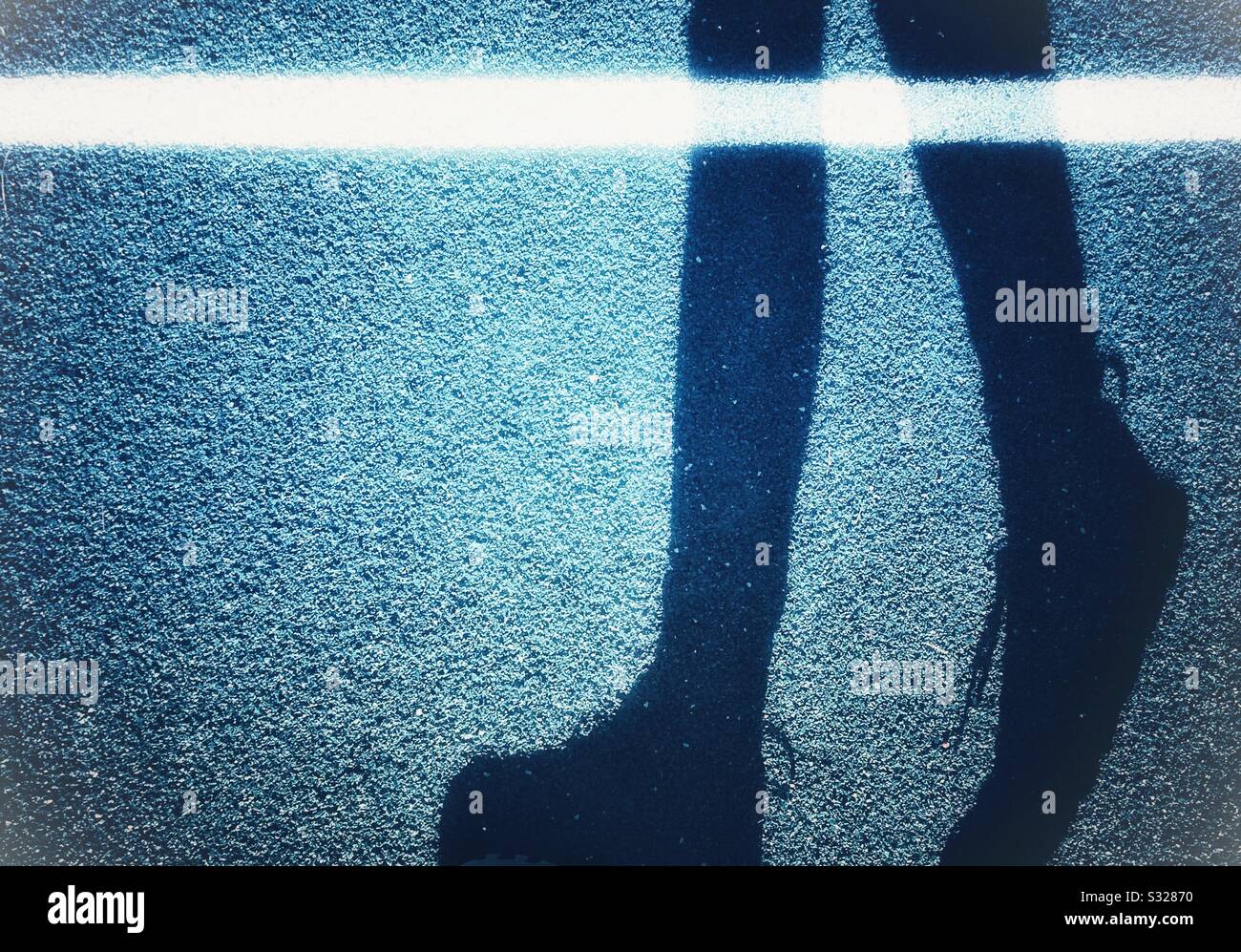 Pedestrian shadow walking - Smartphone Captured Stock Image