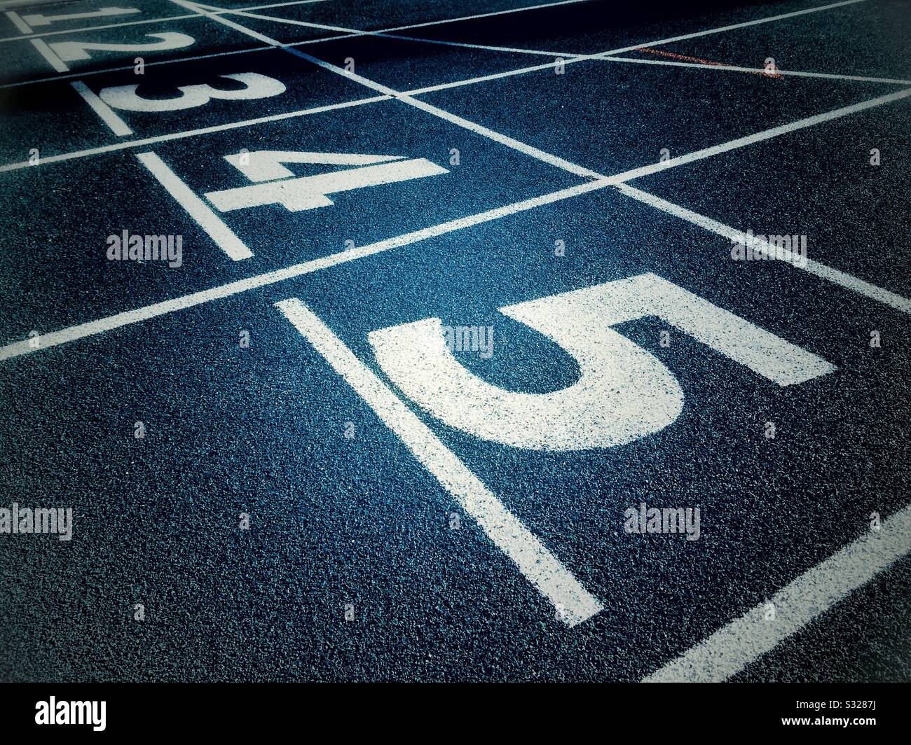Ordinal numbers decreasing on an athletic field track - Smartphone Captured Stock Image