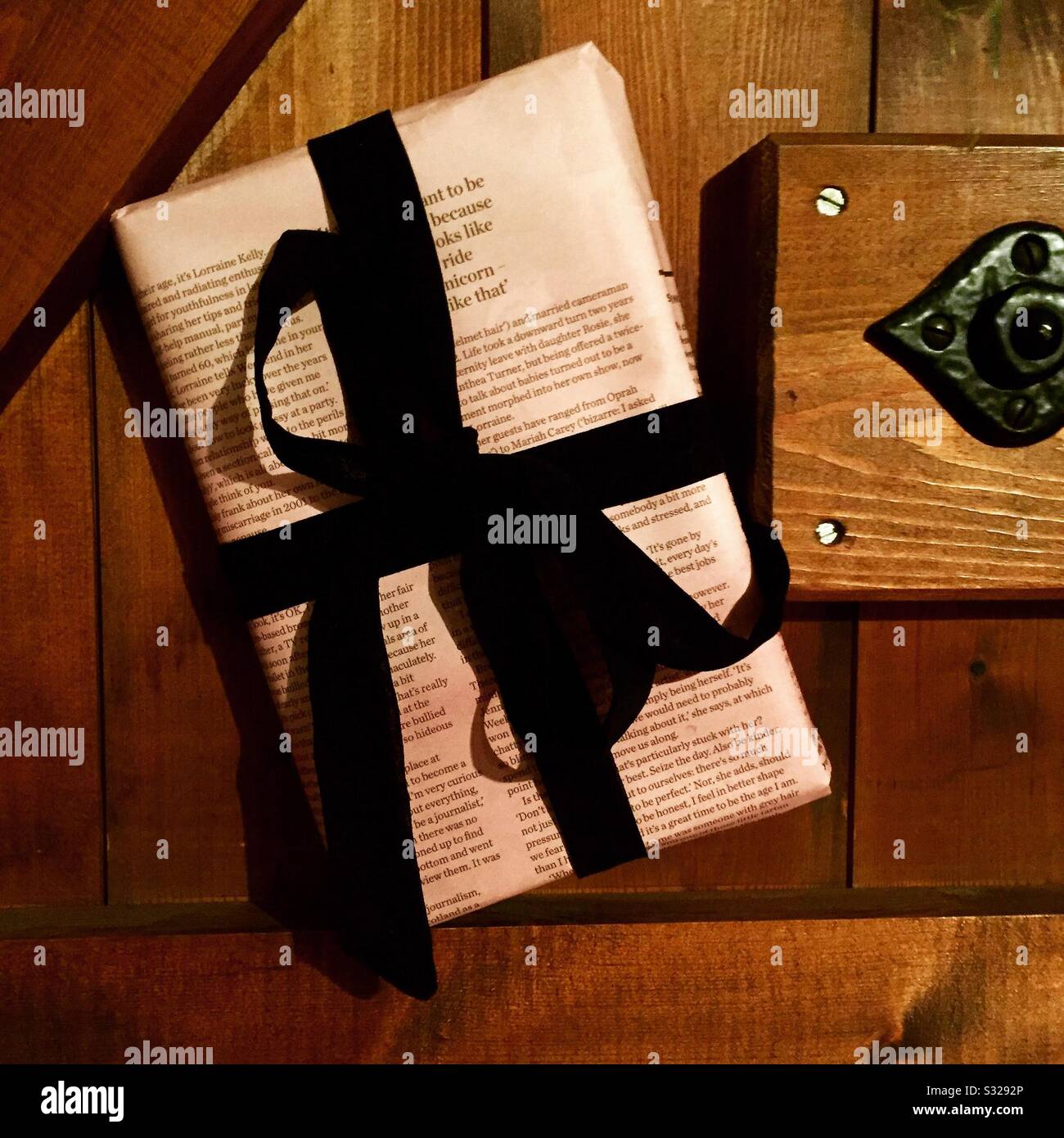 Newspaper wrapping . Gift wrapped book Stock Photo Alamy