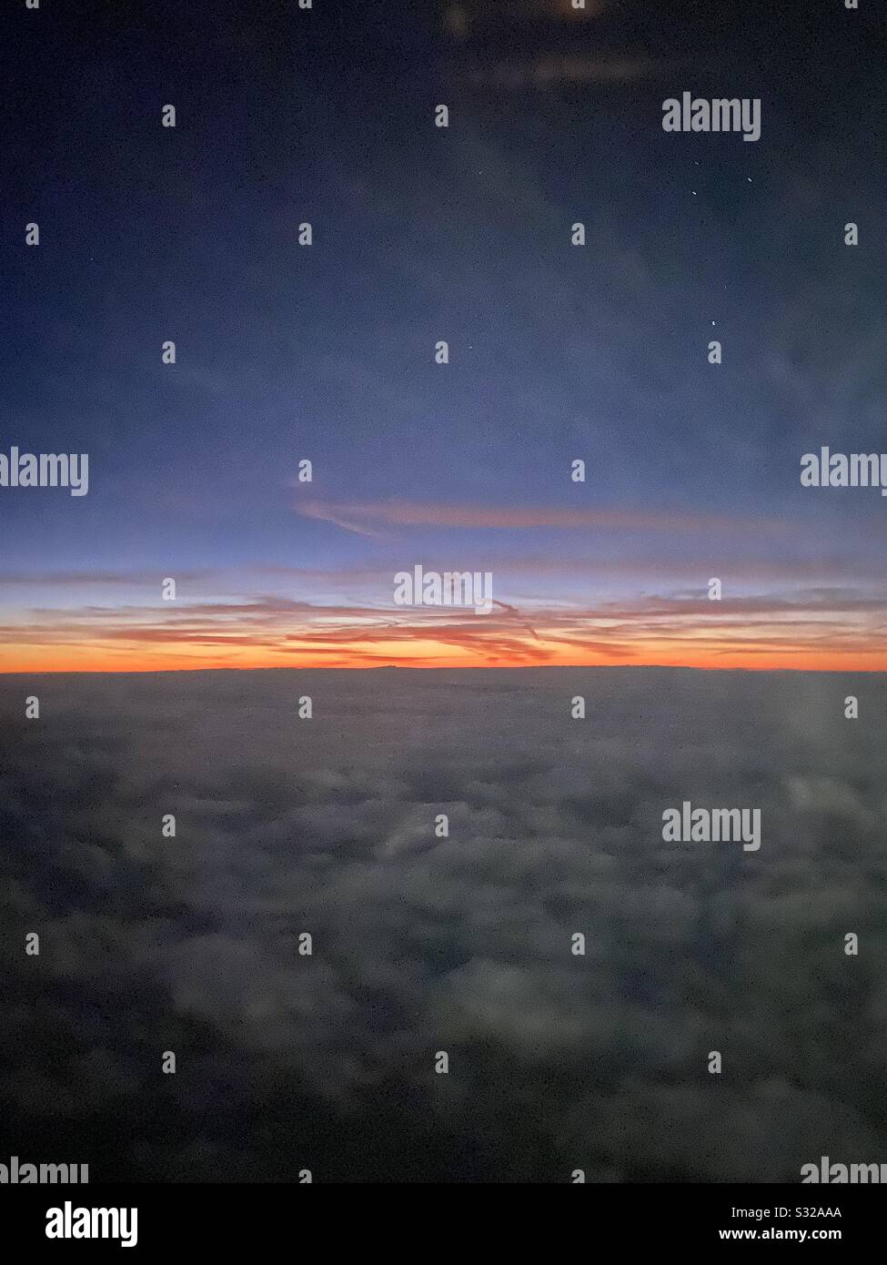 5 am view of skies from a plane Stock Photo