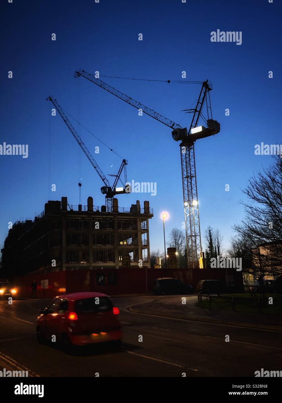 Two construction cranes at commercial building site in Perrymount Road