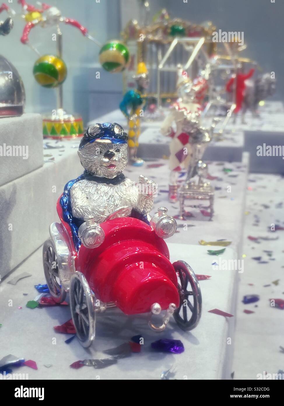 Miniature Tiffany Bear driving a car figurine in a circus setting in an auction preview at Christie’s, NYC, USA - Smartphone Captured Stock Image
