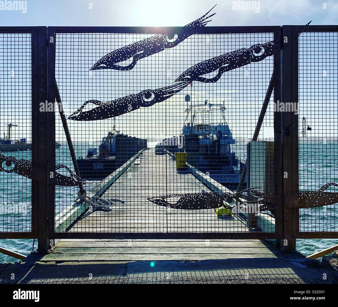 A gate to a dock in Woods Hole, Falmouth, Cape Cod, Massachusetts, United States - Smartphone Captured Stock Image