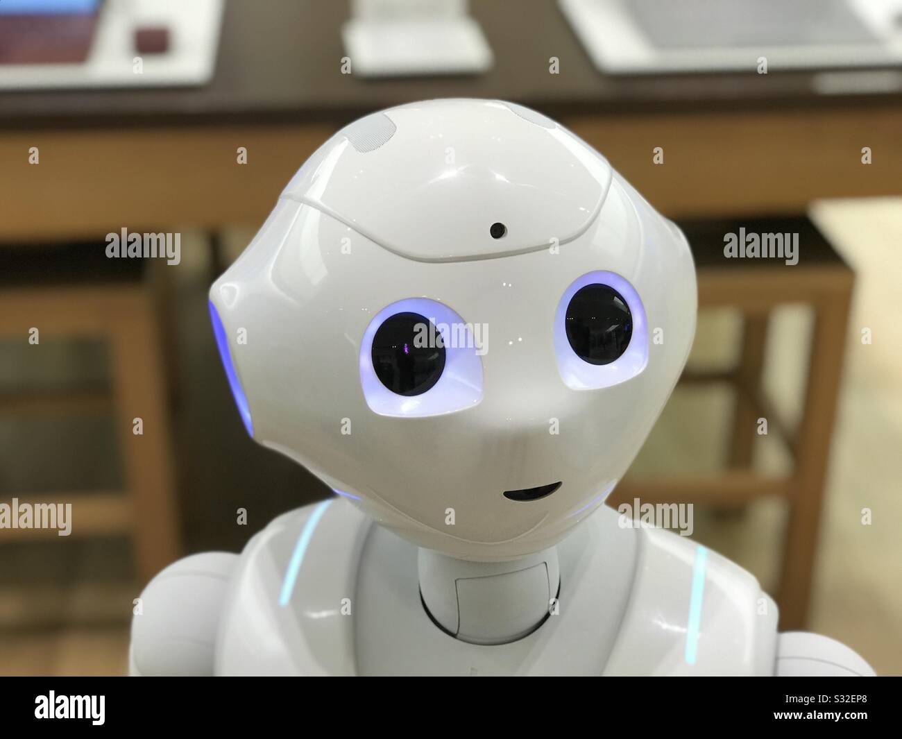 The head of a robot assistant named Pepper made by SoftBank Robotics in a mall in the US. Minneapolis, MN/USA. May 31, 2018. Pepper was built to connect people, assist them and share knowledge. Stock Photo