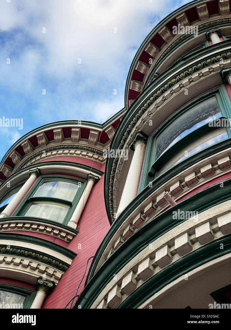 View looking up at painted ladies Victorian houses in San Francisco - Smartphone Captured Stock Image