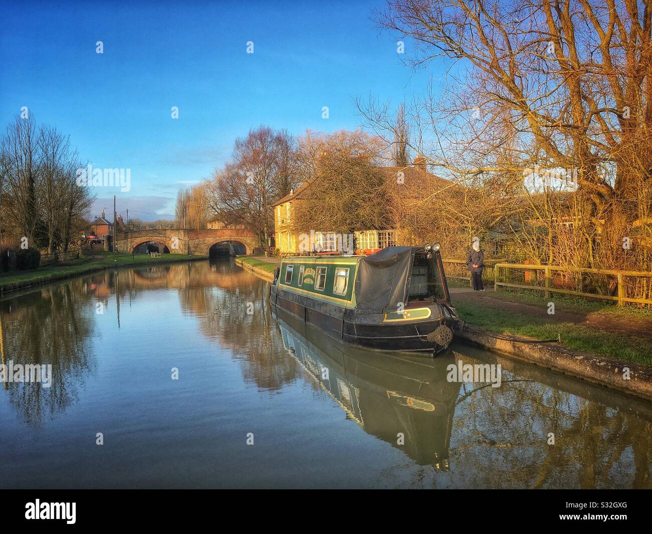 Narrowboat moored on the Grand Union canal at Stoke Bruerne, UK - Smartphone Captured Stock Image