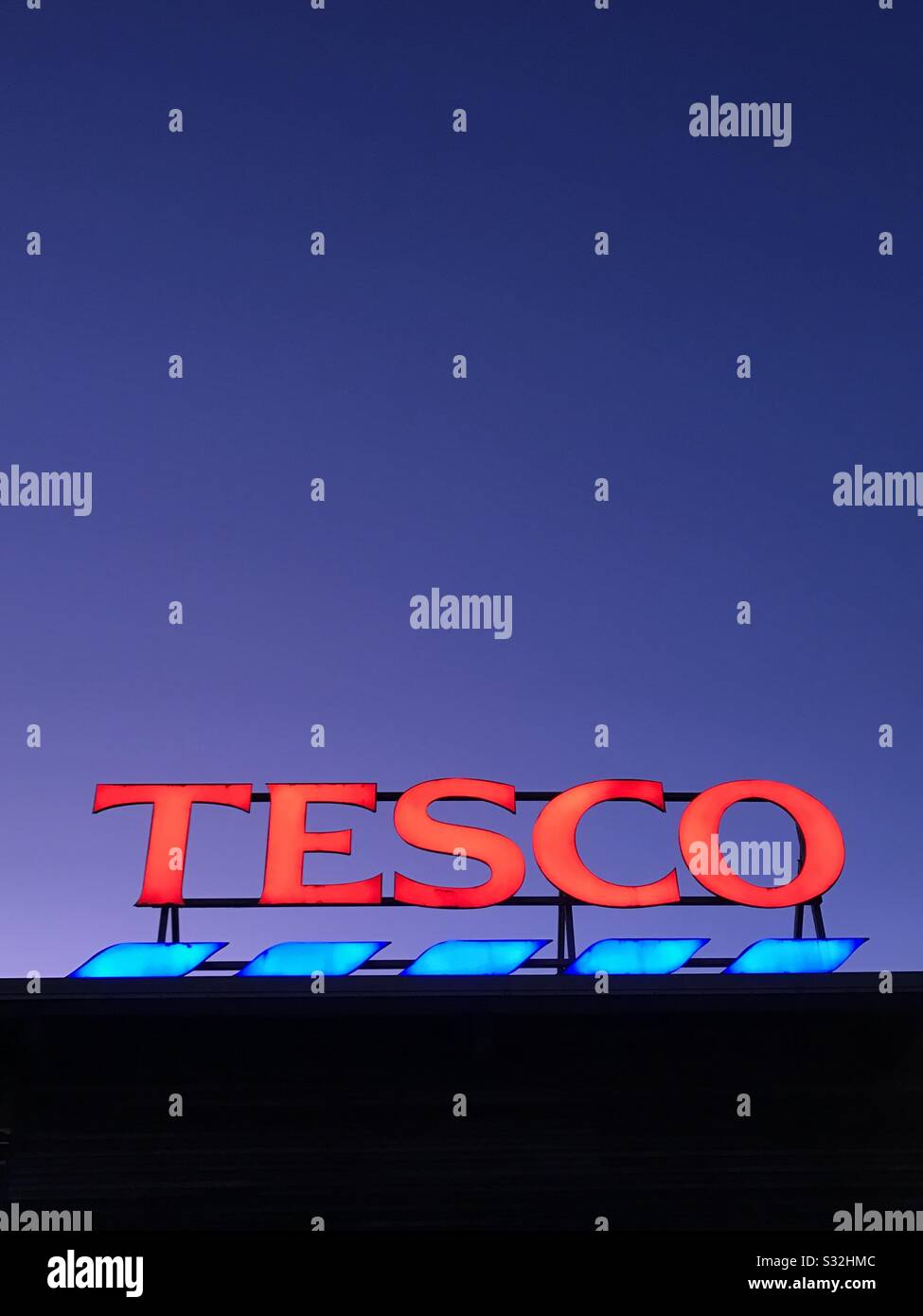A neon Tesco sign - Smartphone Captured Stock Image