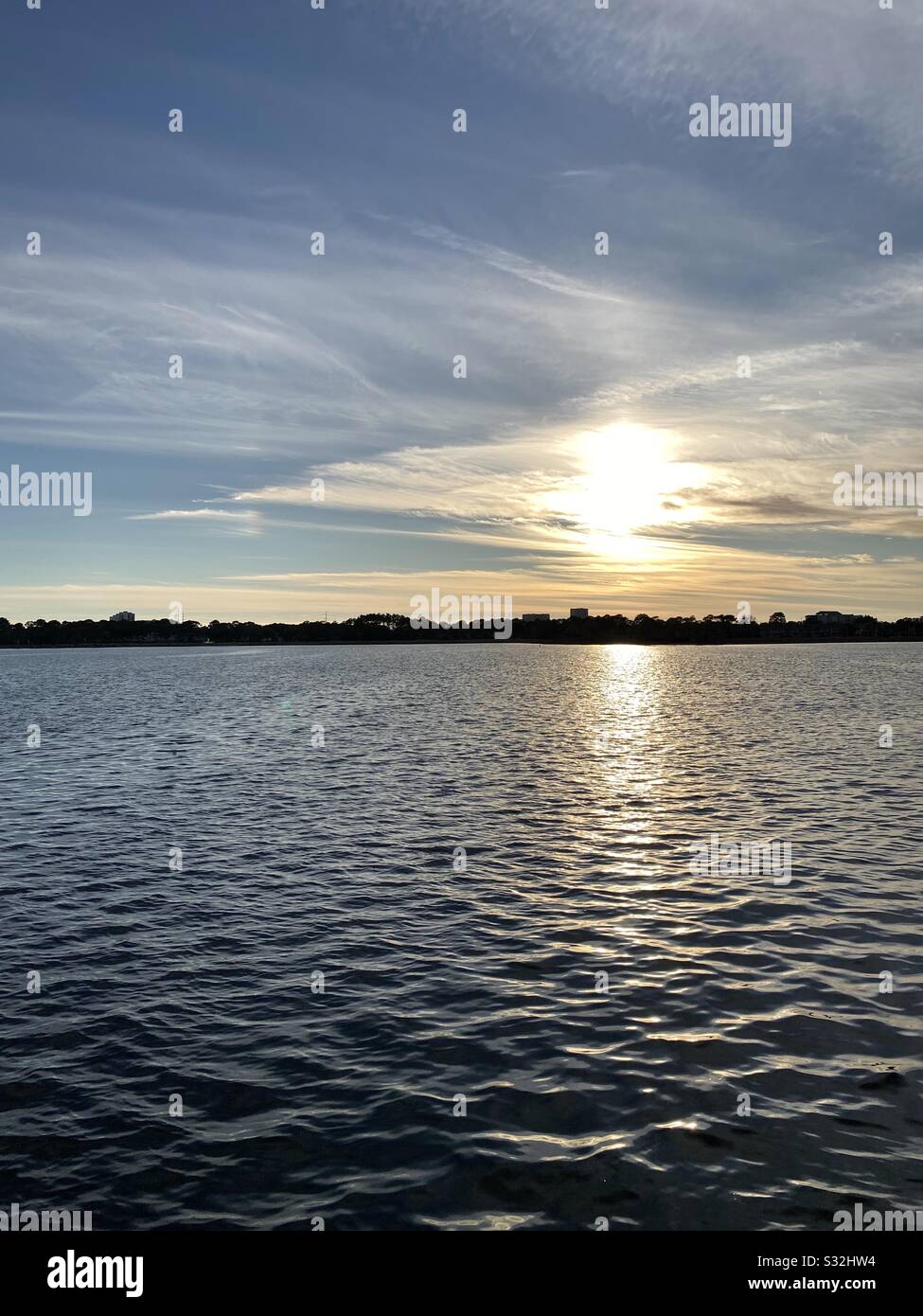 Late evening golden skies reflecting on the Gulf of Mexico water - Smartphone Captured Stock Image